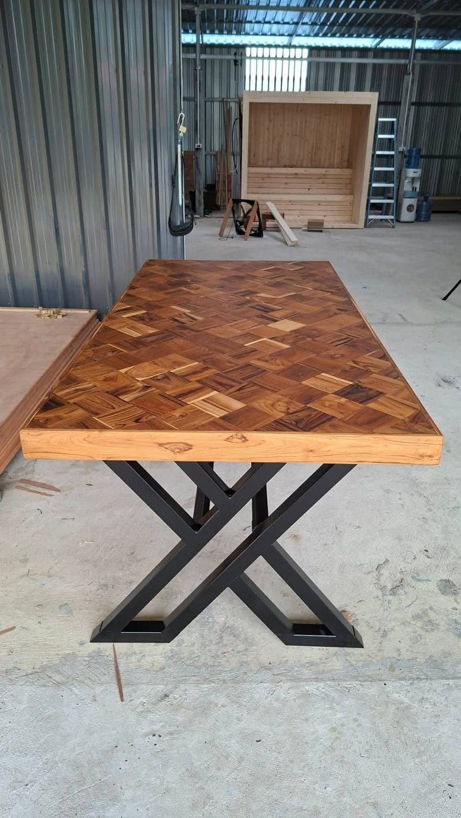 Herringbone teak top on a black steel X-frame, 1 × 2 m