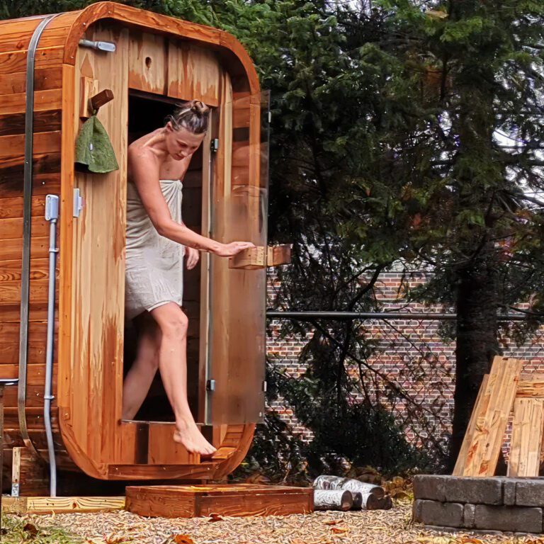 Sabai Dee Traditional Sauna with lady walking out the door in a towel