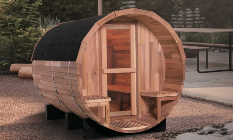 4 Person Barrel Sauna with dim sunset lighting on dir ground and a proch
